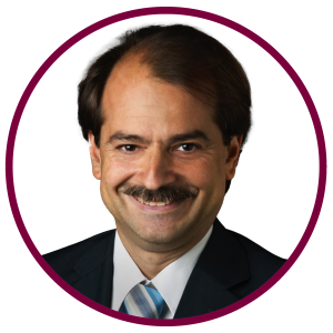 A close up photo of John Ioannidis on a white background.